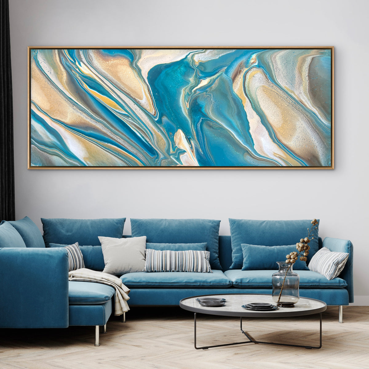 Large original contemporary seascape abstract painting by Australian artist Taylor Rose inspired by the ocean. Featuring flowing teal, beige and white acrylic layers, displayed in a modern lounge room above a blue couch with a natural oak floating frame.