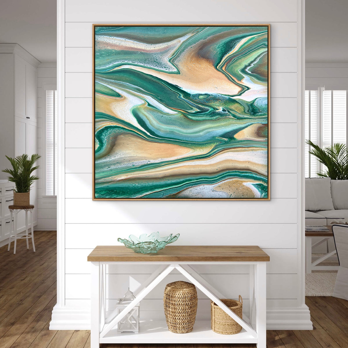 Ready to hang original modern abstract painting by Australian artist Taylor Rose inspired by nature. Featuring flowing emerald green, beige, gold and white acrylic layers, displayed in a modern home with a natural oak floating frame.